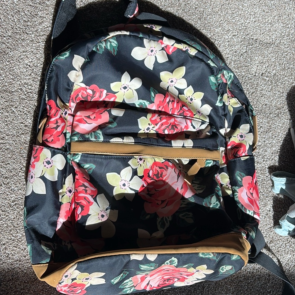 floral and black backpack